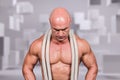 Composite image of bald man with rope around neck