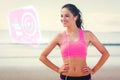 Composite image of beautiful smiling healthy with earphones on beach Royalty Free Stock Photo