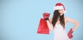 Composite image of beauty brunette in boxing gloves with shopping bag Royalty Free Stock Photo