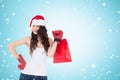 Composite image of beauty brunette in boxing gloves with shopping bag Royalty Free Stock Photo