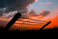 Composite image of bended barbed wire and chainlink fence against white background 3d Royalty Free Stock Photo