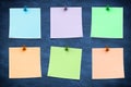 Composite image of blue sticky note with thumbtack