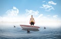 Composite image of boxer standing in a sailboat