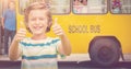 Composite image of boy showing thumbs up while smiling Royalty Free Stock Photo