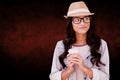 Composite image of brunette with disposable cup Royalty Free Stock Photo