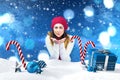 Composite image of brunette in winter clothes with hands out