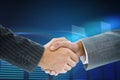 Composite image of business handshake against glowing Royalty Free Stock Photo