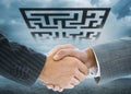 Composite image of business handshakeagainst puzzle maze