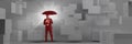 Composite image of business man holding files and umbrella with grey boxes background