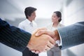 Composite image of business people shaking hands Royalty Free Stock Photo