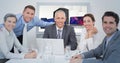 Composite image of business team looking at camera Royalty Free Stock Photo