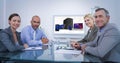 Composite image of business team looking at white screen Royalty Free Stock Photo