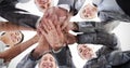 Composite image of business team standing hands together Royalty Free Stock Photo