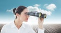 Composite image of business woman looking through binoculars Royalty Free Stock Photo