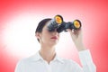 Composite image of business woman looking through binoculars Royalty Free Stock Photo