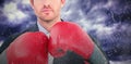 Composite image of businessman with boxing gloves Royalty Free Stock Photo