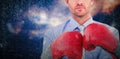 Composite image of businessman with boxing gloves Royalty Free Stock Photo