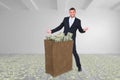 Composite image of businessman carrying bag of dollars Royalty Free Stock Photo