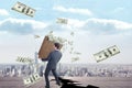 Composite image of businessman carrying bag of dollars Royalty Free Stock Photo