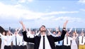 Composite image of businessman cheering with hands raised Royalty Free Stock Photo