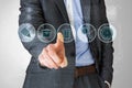 Composite image of businessman in grey suit pointing at menu