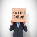 Composite image of businessman hiding head with a box Royalty Free Stock Photo
