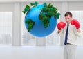 Composite image of businessman with his boxing gloves Royalty Free Stock Photo