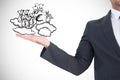 Composite image of businessman with his hand out Royalty Free Stock Photo