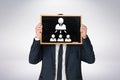Composite image of businessman holding board Royalty Free Stock Photo