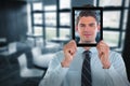 Composite image of businessman holding digital tablet in front of face Royalty Free Stock Photo