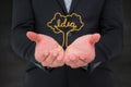 Composite image of businessman holding his hands out Royalty Free Stock Photo