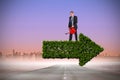 Composite image of businessman holding red watering can Royalty Free Stock Photo