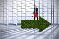 Composite image of businessman holding red watering can Royalty Free Stock Photo