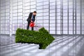 Composite image of businessman holding red watering can Royalty Free Stock Photo