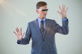 Composite image of businessman imagining while using virtual reality glasses Royalty Free Stock Photo