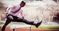 Composite image of businessman jumping a hurdle Royalty Free Stock Photo