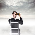 Composite image of businessman looking on a ladder Royalty Free Stock Photo