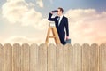 Composite image of businessman looking on a ladder Royalty Free Stock Photo