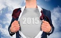 Composite image of businessman opening shirt in superhero style