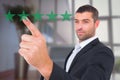 Composite image of businessman pointing with finger Royalty Free Stock Photo