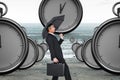 Composite image of businessman pushing the wind with umbrella Royalty Free Stock Photo