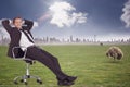 Composite image of businessman relaxing in swivel chair Royalty Free Stock Photo