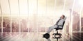 Composite image of businessman relaxing in swivel chair Royalty Free Stock Photo