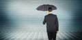 Composite image of businessman sheltering under black umbrella Royalty Free Stock Photo