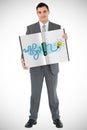 Composite image of businessman showing a book Royalty Free Stock Photo