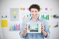 Composite image of businessman showing digital tablet with blank screen in creative office Royalty Free Stock Photo