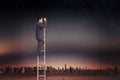 Composite image of businessman standing on ladder using binoculars Royalty Free Stock Photo