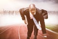 Composite image of businessman in the starting blocks