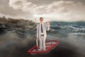 Composite image of businessman waving in boat