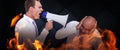 Composite image of businessman yelling with a megaphone at his colleague Royalty Free Stock Photo